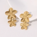 Elegant gold flower earrings with layered petals and textured metallic finish on white - Gold
