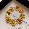 Detailed macro view of vintage gold bracelet with colorful enamel inlay and zircons - 55# Vintage Geometric Enamel Gemstone Bracelet - Multicolor