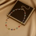 Golden heart-shaped necklace with colorful gemstones on champagne silk background - 1# Gold Heart Gemstone Necklace