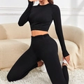 Set yoga nero a costine con crop top a maniche lunghe e leggings a vita alta aderenti - S / Nero