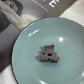 Cute matte gray-purple bear hair claw clip displayed on a blue ceramic plate - Dark Gray