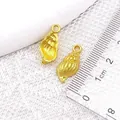 Golden alloy shell charm pendant for DIY jewelry, measuring 20x10x4mm with top ring - XK1921# Conch