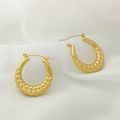 Macro shot of gold-plated U-shaped earrings with twisted braid texture on white silk - Wheat Twist Style (XL1464-52)