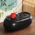 Zen ceramic water fountain with black matte base and vibrant red bird-shaped spout - Like Fish in Water - Long Black Style