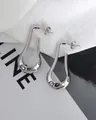 Detailed view of silver teardrop earrings with high-polish mirror finish in minimalist style - Silver