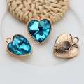 Blue crystal heart charms in 12mm gold alloy frames with radial textured finish - Sky Blue