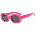 Fashionable pink oval sunglasses with metallic studs and dark lenses on white background - Rose Red