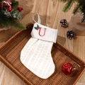 White cable knit Christmas stocking with red embroidered letter U for holiday decoration - Letter U