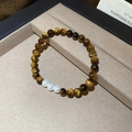 Close-up of vintage tiger eye beads and white pearls on a minimalist jewelry tray - Pearl and Tiger Eye Combination (Style 2)