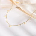 Elegant gold titanium necklace with geometric zircon charms on white stone and satin - White Zircon Square Necklace / Gold