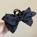 Pince à cheveux élégante à nœud en tissu noir avec texture subtile à pois fins - Pince Nœud Noir