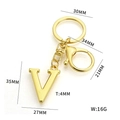 Golden metal letter V keychain pendant with dimension markings and glossy finish - Letter V