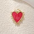 Detail showing a red heart pendant with a gold-beaded border and polished finish - Gold Red Enamel Heart