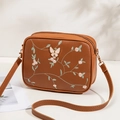 Brown PU leather crossbody camera bag featuring floral embroidery and butterfly hardware - Brown