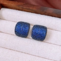 Macro shot of blue zircon square stud earrings in cushion-cut style and luxury setting - Arc / Silver Needle / Dark Blue