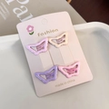 Detalle de cuatro pinzas para el cabello de mariposa en colores pastel con tarjeta - Mariposa Brillante