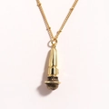 Detailed close-up of a golden microphone pendant with a premium polished metallic finish - Black