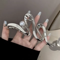 Silver metallic shark hair clip with a minimalist fluid design and white pearl detail - Silver Wave with Pearl