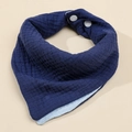 Detail of soft 4-layer cotton gauze baby bib with secure white adjustable snap buttons - Navy Blue + Sky Blue