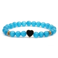 Bracciale di perle occhio di gatto azzurro con ciondolo a cuore nero e dettagli dorati - Nero