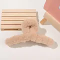 Detail shot of a beige plush hair claw clip showing soft faux fur texture and arched design - 14cm Large Plush Claw - Khaki
