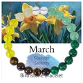 March Birthstone Bracelet detail with malachite beads and message card background - March