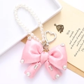 Pink satin bow keychain with pearl chain and rhinestone heart pendant for bags - Pink