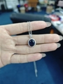 Silver necklace with oval dark blue sapphire pendant surrounded by white diamonds - Blue Diamond Necklace Tz-4