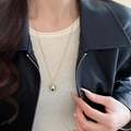 Minimalist golden sphere pendant necklace with a fine metal chain on a female model - Gold Mirror Ball Style (53#)