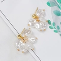 Detailed macro view of gold-plated tassel earrings with white shell pearl petals - Gold Tassel Shell Cluster Style (E1775/Earring Post)