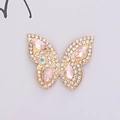 Macro detail of alloy butterfly accessory with sparkling pink gemstones and clear rhinestones - D1175 Horse Eye Butterfly Gold Pink