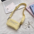 Light yellow crossbody bag with white bow embroidery and a pearl heart charm - Yellow