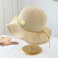 Detailed close-up of beige straw hat featuring yellow tulip embroidery and silk ribbon - Beige with Orange Ribbon