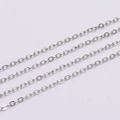 Macro detail of parallel silver-tone cross chain links with a polished metal finish - Rhodium