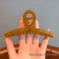 Large amber resin hair claw clip in twisted design for women, size 12.5cm long - Crisscross Jelly Coffee - Approx 13cm