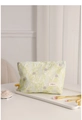 Detail of floral makeup bag with H&R BAG logo on white tray with cosmetics - Green Leaf Purple Floral