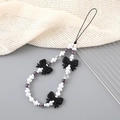 Pendentif de téléphone en perles avec nœud noir et perles violettes au style moderne - Style cœur 3 nœuds noir (K3176)