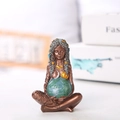 Close-up of Mother Earth resin statue with gold sun and moon details on goddess figure - Mother Earth Small