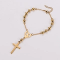 Dettaglio di un bracciale rosario dorato con ciondolo a cuore di Maria e croce pendente - Oro / 17+3cm