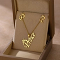Golden Prince crown necklace and P initial earrings set displayed in a premium jewelry box - Prince Crown Text (TZ-493)