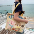 Canvas tote bag in cream with yellow straps featuring cute cartoon cats and tomato prints - Tomato Cat