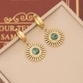 Macro detail of gold sunburst drop earrings featuring an inlaid green natural stone - Green Round Sun God Style(2#)