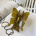 Detail of olive green butterfly hair claw clip with gold metal spring on minimalist magazine - Butterfly Buckle Style / Approx 11cm / Jelly Yellow Green