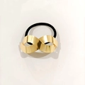 Minimalist black elastic hair tie with a polished gold infinity symbol charm - Infinity