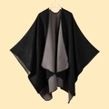 Detailed view of heavy knit black and gray split poncho with stitched hem edges - Double-sided Black Gray