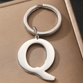 Silver metal keychain with uppercase letter Q pendant on a round ring, closeup view - Letter Q