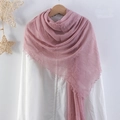 Pink crinkle cotton linen scarf with frayed edges hanging on a wooden hanger - Pink