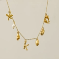 18k gold plated necklace with freshwater pearl, sea star charms and coral letter K - Letter K