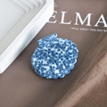 Macro view of shell-shaped hair claw with blue marble texture on a white tray - 3# Blue White Marble