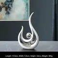 Scultura moderna in ceramica bianca e argento Phoenix per decorazioni di lusso - Volo di Fenice - Bianco Argento Corto